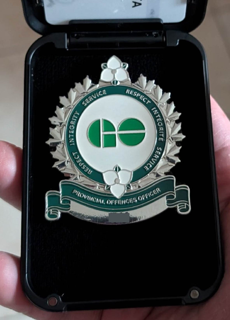 Badge of a Provincial Offences Officer in a badge wallet