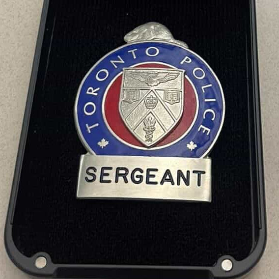 Toronto Police Sergeant badge in a black badge wallet with 'IdleTac' branding.